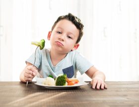 child going to eat vegetables